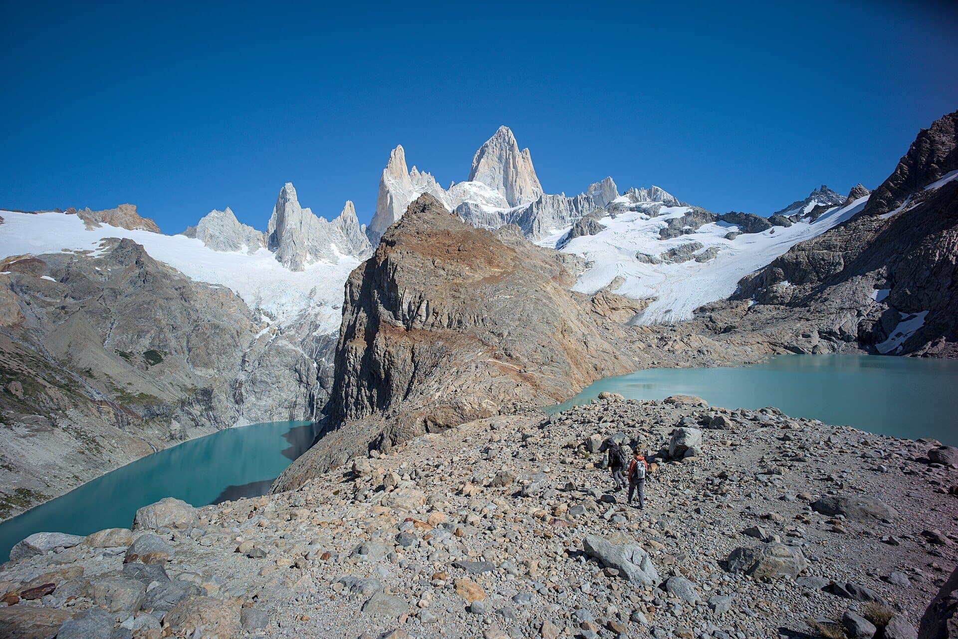 Hikers above Laguna de los Tres below Mount Fitz Roy