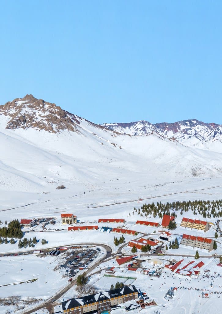 The village below snow-covered peaks